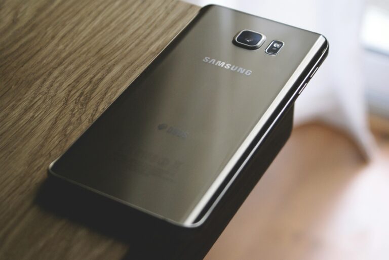 A sleek Samsung smartphone placed on a wooden surface, capturing modern elegance. one of the most famous electronics
